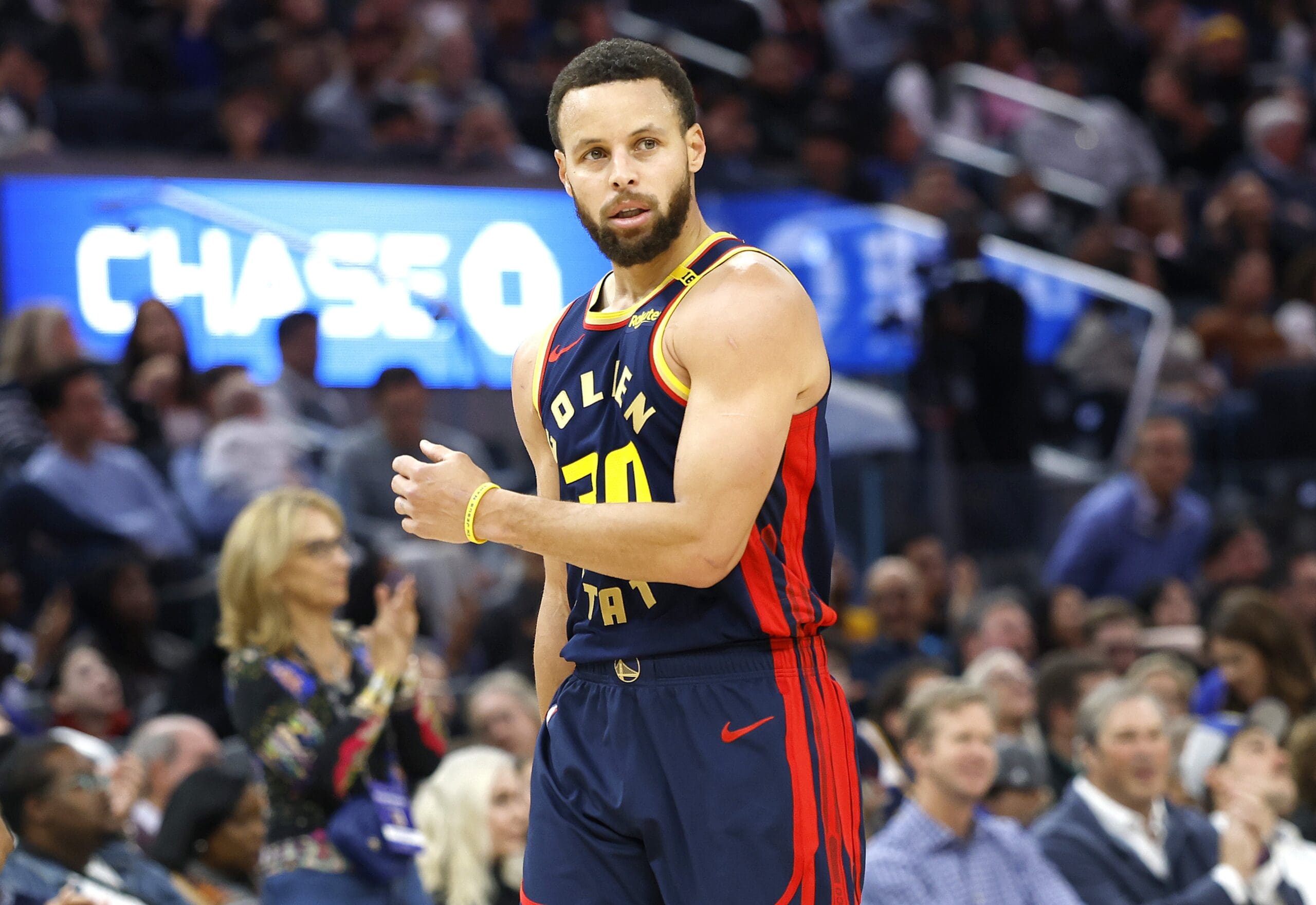Stephen Curry #30 of the Golden State Warriors reacts after making a three-point shot against the Miami Heat during the first half of an NBA basketball game at Chase Center on January 07, 2025 in San Francisco, California.