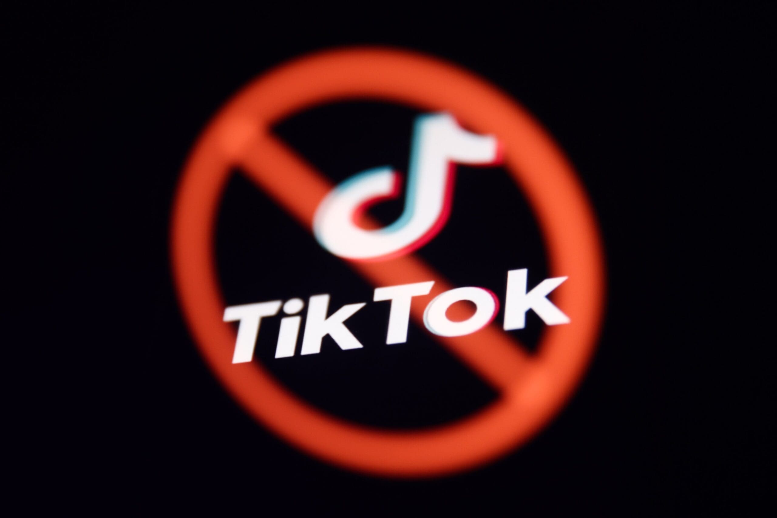 tiktok logo with a red x circle through it