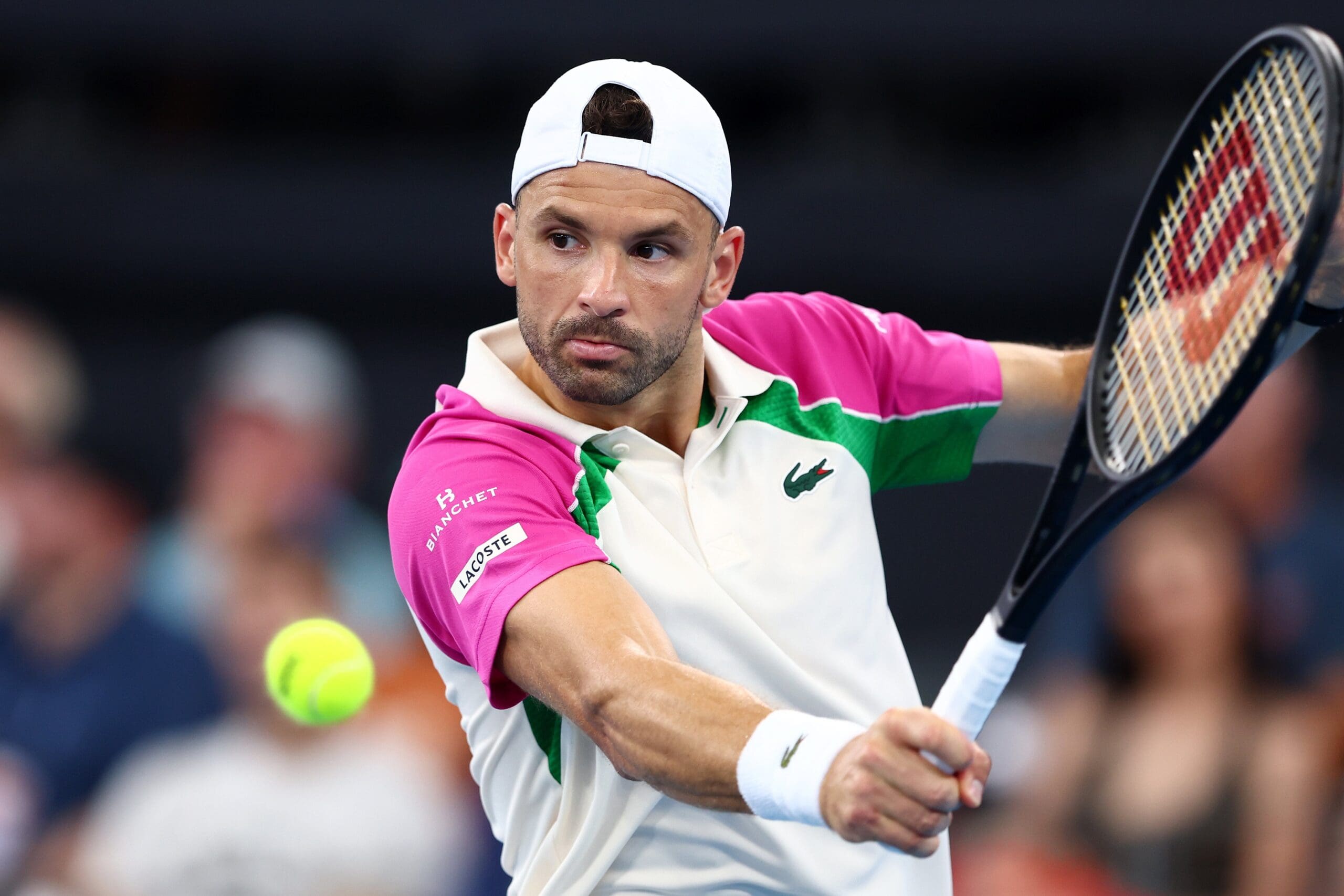 Grigor Dimitrov of Bulgaria plays a backhand