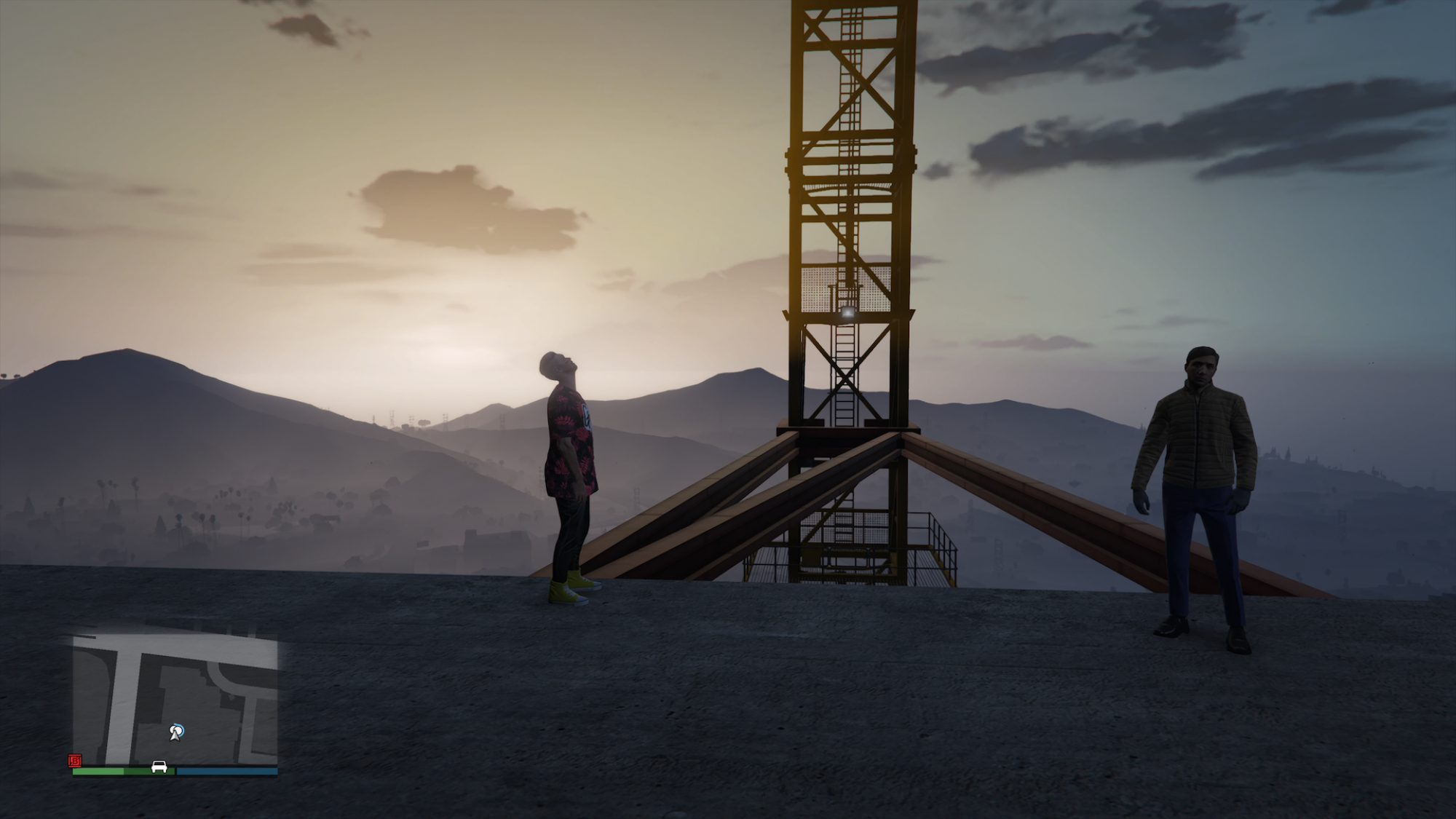 Two characters stand on a hilltop in "Grand Theft Auto".