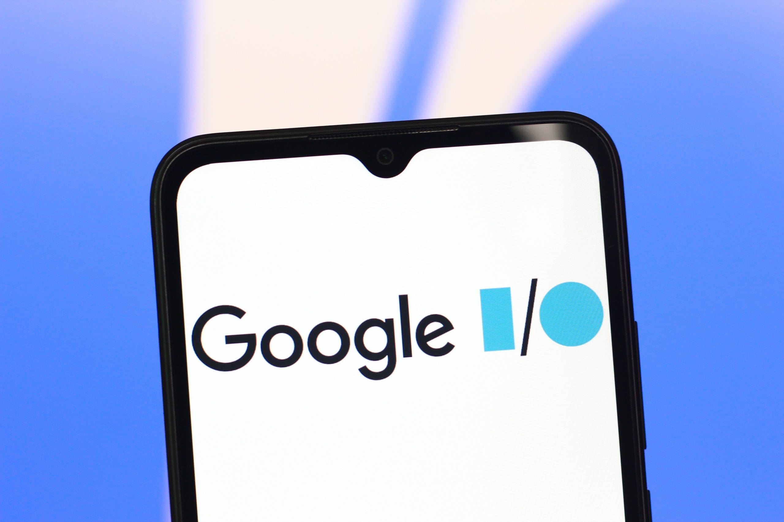 the Google I/O logo is seen displayed on a smartphone screen.