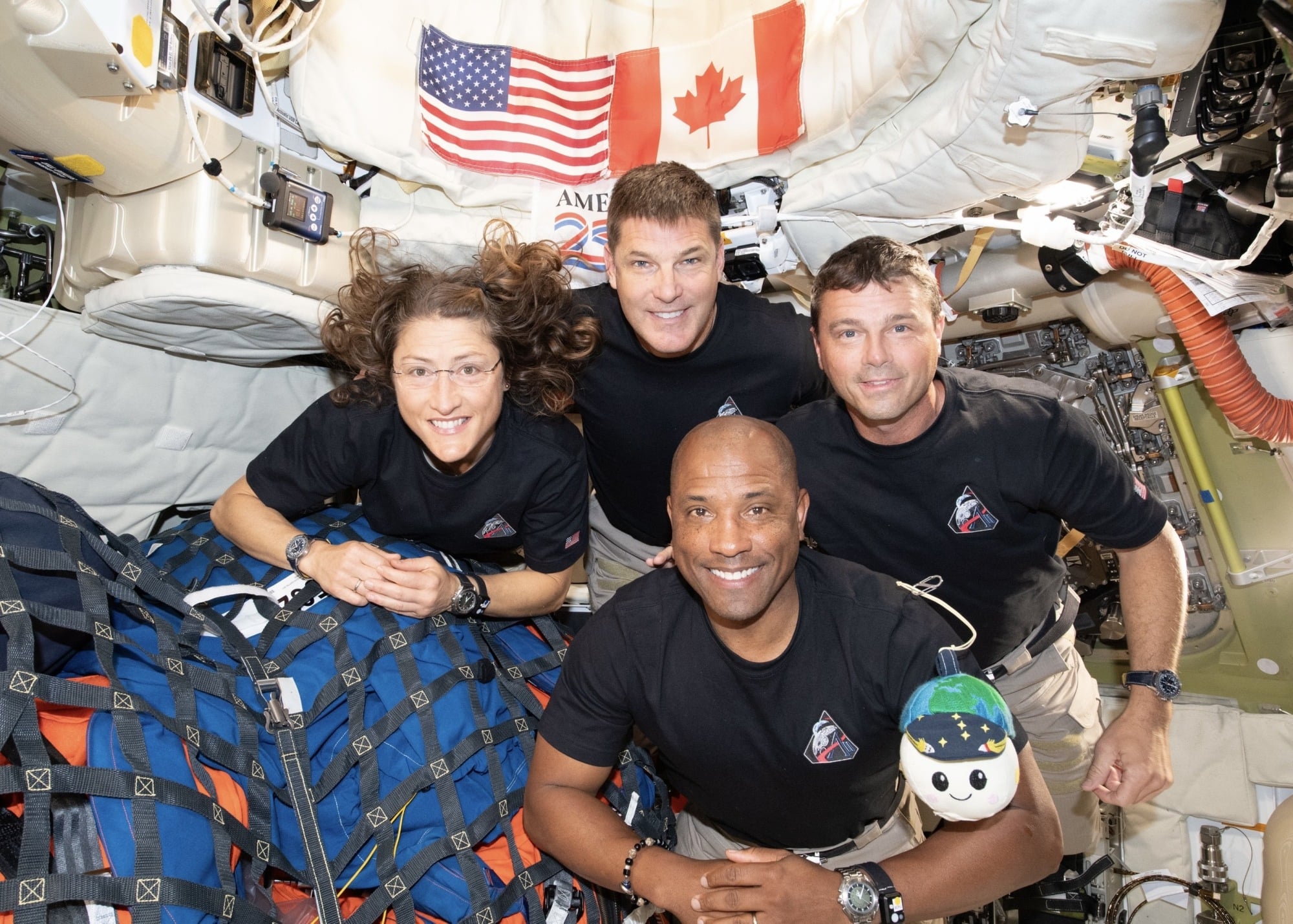 The Artemis II crew posing in weightlessness with Rise