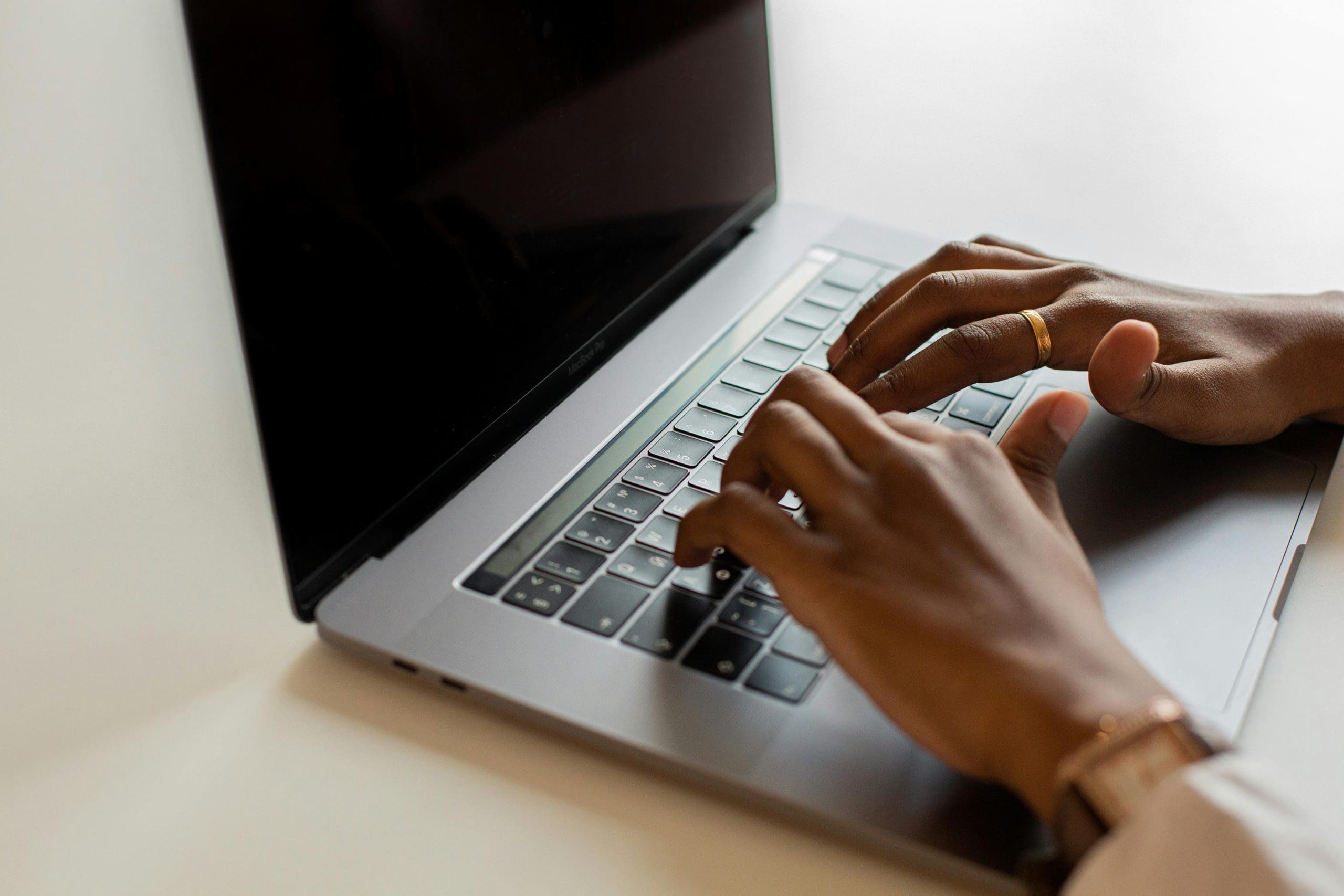 Typing on laptop